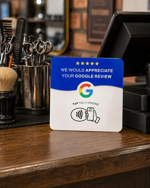 The Tap NFC review card on a barbershop counter