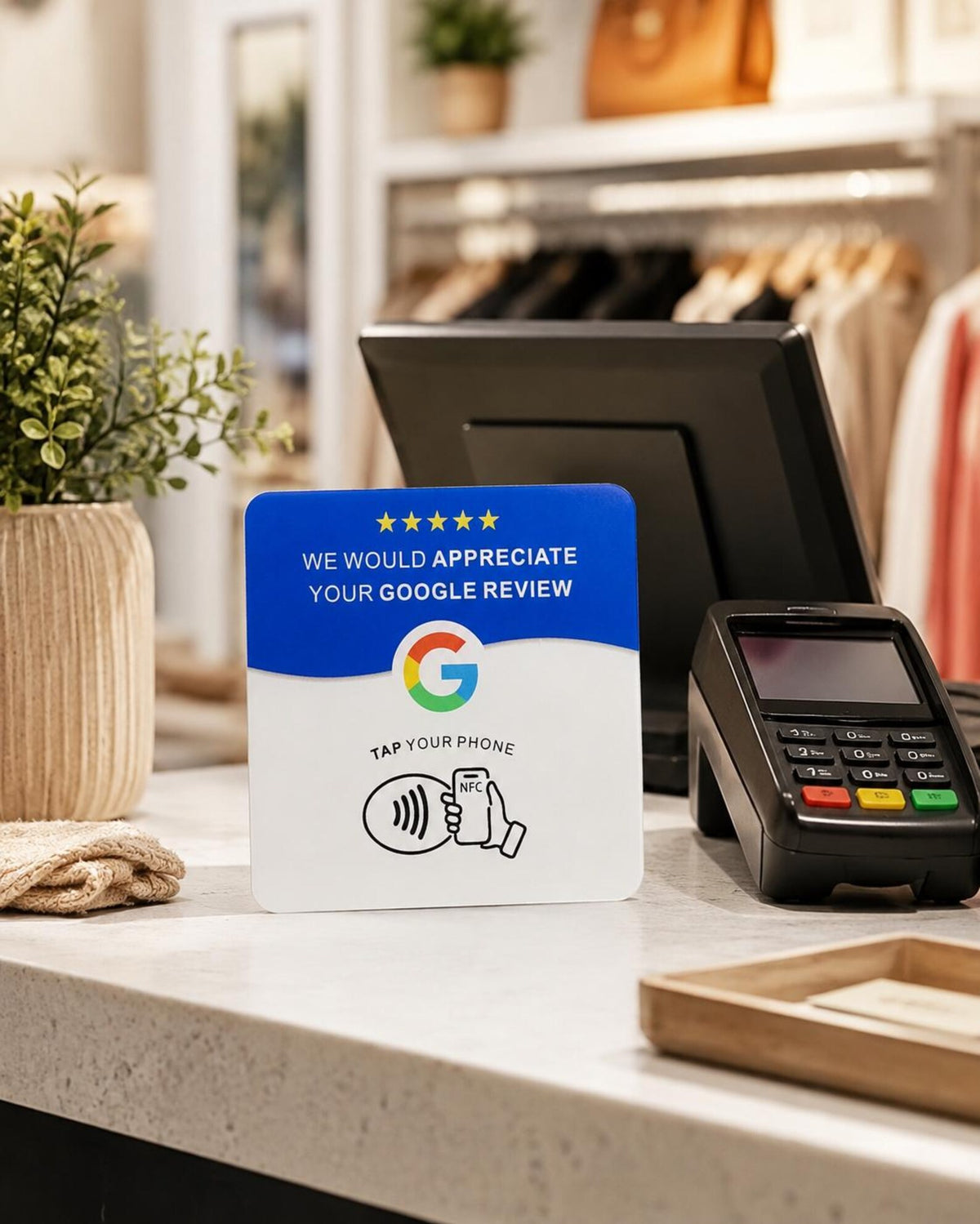 The Tap NFC review card on a boutique retail counter