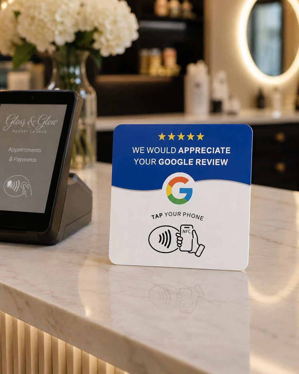 The Tap NFC review card on a salon reception counter